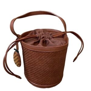 Etienne Aigner paper straw rattan bucket bag with pineapple embellishment